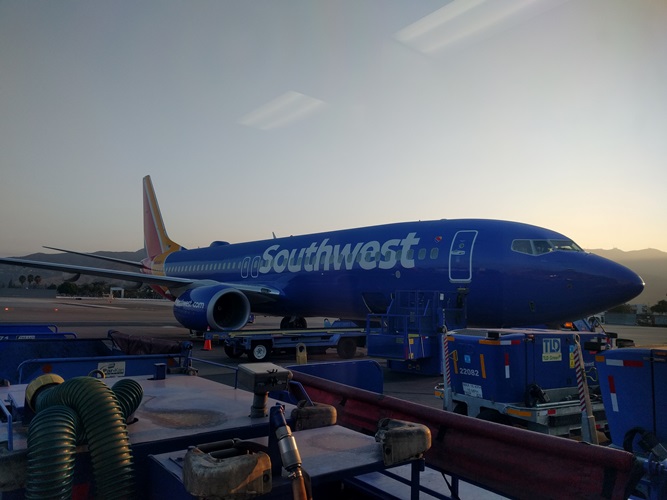 An airplane sitting at a airport gate.